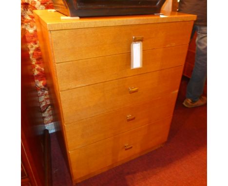 A mid 20th century light oak chest fitted five drawers 
