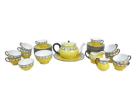 An Art Deco Aynsley part tea service, pattern 3268, decorated with a patterned band of black and white against a yellow groun