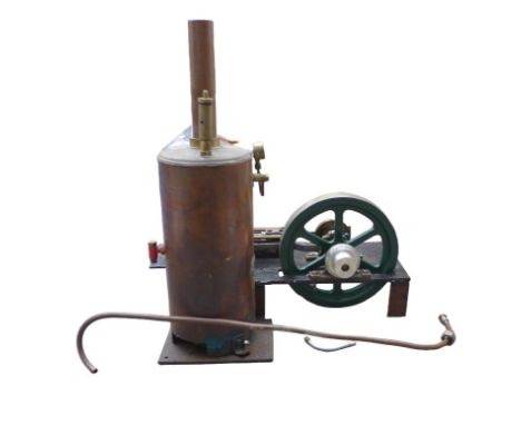 A miniature single-piston stationary engine and boiler, with piston housing marked 'KB' and boiler gauge marked 'Bruce Engine