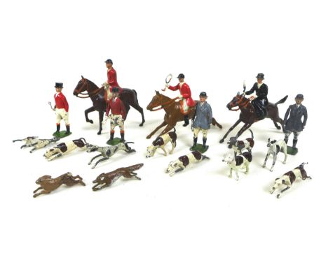A Britains fox hunting set, comprising three mounted huntsmen, nine hounds, a fox, a hare, and four standing huntsmen. (1 box