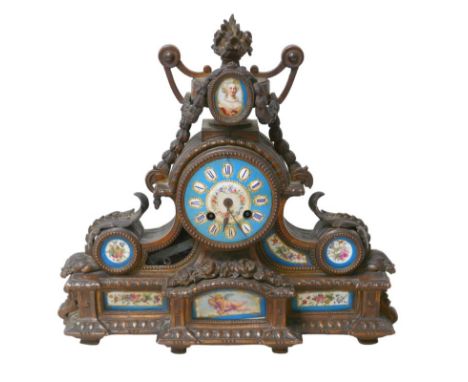 A 19th century mantel clock, with Roman numeral dial, brass mounts and enamel panels, 37 by 11 by 34cm high, a/f.