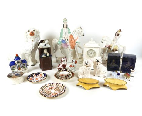 A group of ceramics, including seven Staffordshire figures, 'Harvest', 30cm high, and a pair of dogs by Royal Doulton, 15cm h