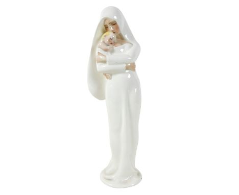 An Italian Art Deco glazed pottery figure, by Lenci, modelled as 'Madonna del Vento', a woman standing dressed in long white 