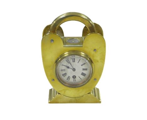An early 20th century brass cased padlock shaped desk clock, with compass to its top and a Roman numeral dial, 13 by 6.5 by 1