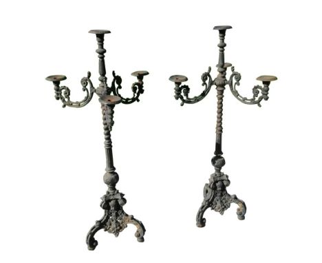 A large pair of reproduction style floor standing triple branch candelabra in the baroque style, 44" high.