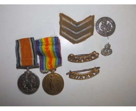 A WWI medal pair - War &amp; Victory Medals awarded to 46659 Pte C. J. Eyland, The Queen's R., together with four badges and 