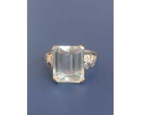 An 18ct white gold aquamarine solitaire ring, the rectangular cut stone measuring  14mm across. Finger size U.