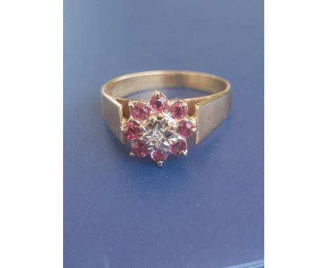 A modern illusion set ruby &amp; diamond cluster ring in 18ct gold.  Finger size M.