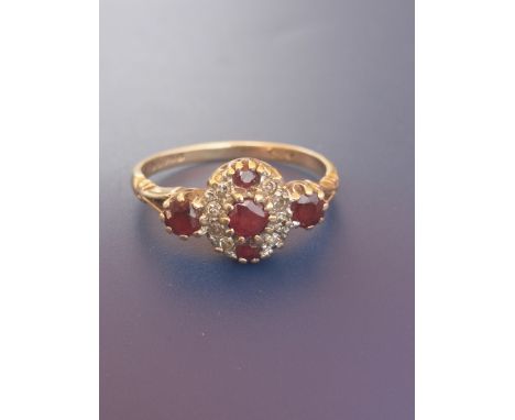 A ruby &amp; diamond set 9ct gold ring.  Finger size Q.