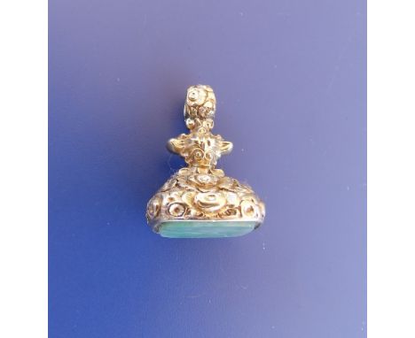 A gold pendant seal set with jade, 1.2" high.
