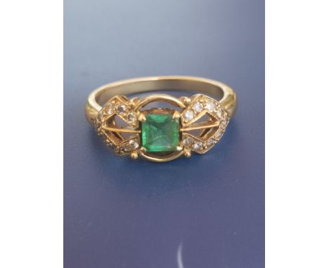 An art deco emerald &amp; diamond set 18ct gold ring, having central suare cut emerald.  Finger size N.