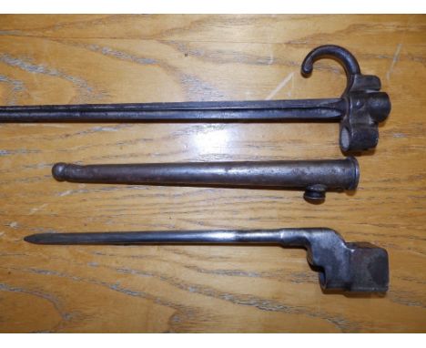 A French bayonet in scabbard - 'RP 96170', 21.5" overall, and an Enfield type bayonet. (2)