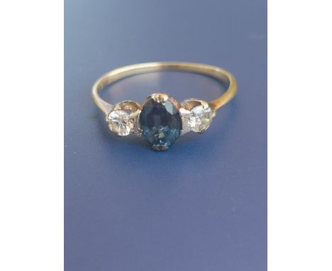 A three stone sapphire &amp; diamond 18ct gold ring.  Finger size Q/R.