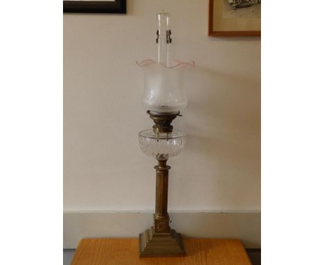 A Victorian brass oil lamp with Germain's Patent Smoke Consumer, 20" excluding shade.