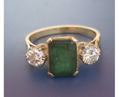 An art deco style emerald &amp; diamond three stone 18ct gold ring - London marks.  Finger size S.