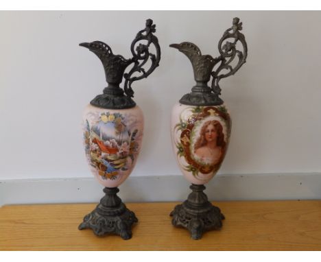 Two continental spelter mounted pink glass ornamental ewers, one decorated with a female portrait, printed &amp; overpainted,