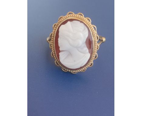 A 9ct gold hardstone cameo ring.  Finger size N.