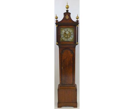 Husband Hull, an early 19th Century oak longcase clock
With arched and pillared hood over a body with arched trunk door and b