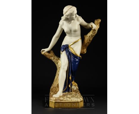 A large Royal Worcester figure, of the bather surprised, gilded and with deep blue drapery, shape no. 486, date cipher for 19