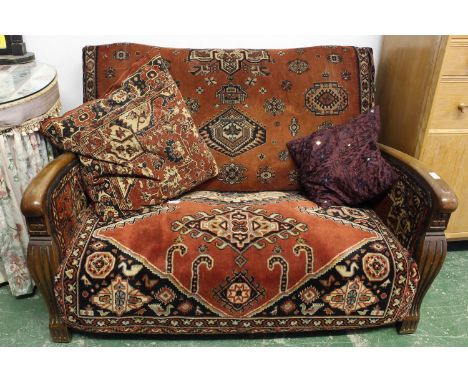 An Art Deco style sofa, the oak frame upholstered in carpet, 127 x 83 x 85cm approx.