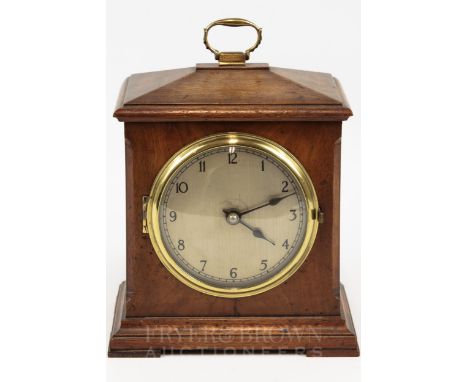 A walnut cased mantel clock, with brass detailing