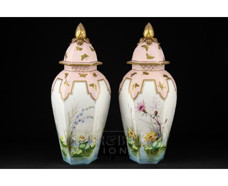 A large pair of Royal Worcester porcelain vases &amp; covers, of hexagonal panelled baluster form, painted in the aesthetic t