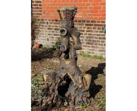 A large saltglaze stoneware tree trunk form planter, probably Scottish, c1886, 104cm high approx.