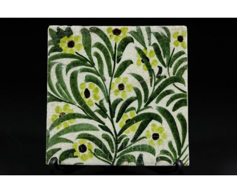 A William de Morgan Boston tile, yellow colourway, flowers interspersed with green leaves, impressed WDE Merton Abbey mark, 1