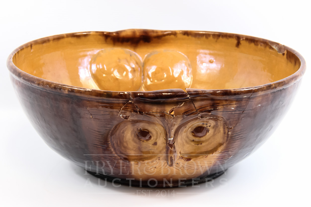 A Farnham Pottery ewer in the form of an owl, by Harry Corrigan, brown