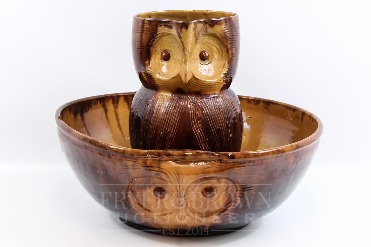 A Farnham Pottery ewer in the form of an owl, by Harry Corrigan, brown