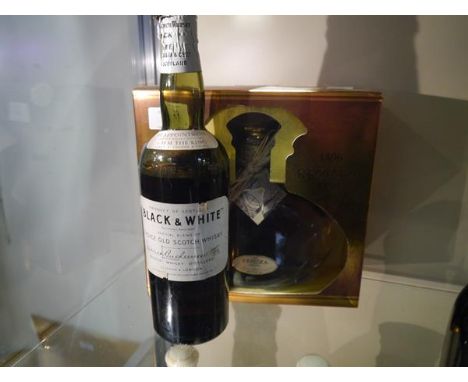 Vintage bottle of black and white Choice old Scotch whisky, some loss, and a bottle of Krzesk Ziolowa