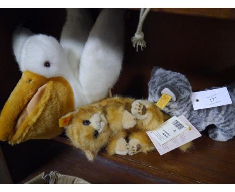 Collection of Steiff plush toys including cat, pelican and tabby cat