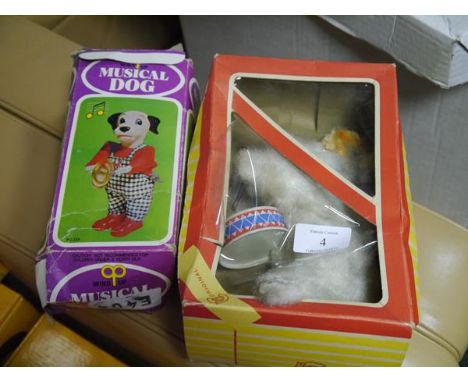 A 1960's West German clockwork musical rabbit, the plush model playing a drum, in its original box;  together with a Hong Kon