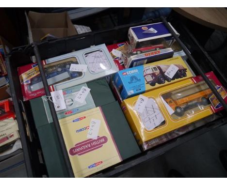 Crate containing a collection of boxed model vehicles including Corgi and Dinky