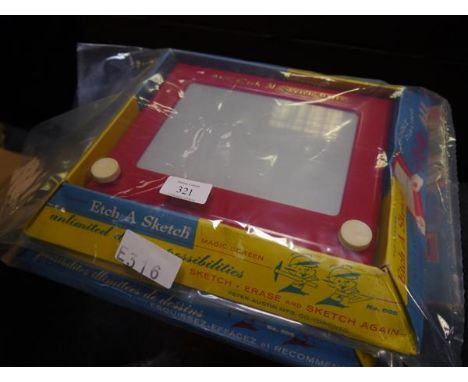 Two vintage etch-a-sketch magic screen games complete with original packaging, and a remote control driving test game