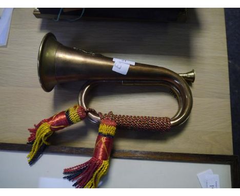 A copper and brass military bugle applied with the badge of the Argyll & Sutherland Highlanders