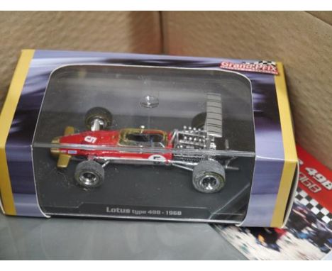 Boxed modern Formula 1 model vehicles, 007 model Aston Martin with collector magazine etc