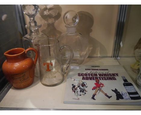 History of Scotch whisky advertising book by John Hughes and a collection of vintage advertising decanters and jugs