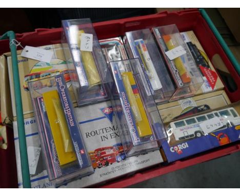 Crate containing a collection of boxed model vehicles including Corgi coaches