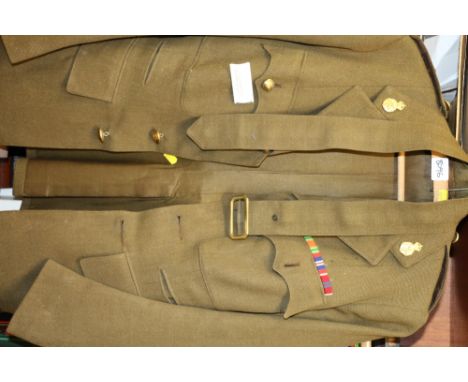 Womans Royal Army Corps WRAC green khaki tunic of Cecily Giles with collar buttons, shoulder buttons and matching belt.