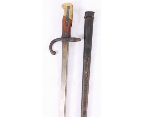 French 1874 pattern bayonet having tapering T -form blade with edge marked for St Etienne October 1877, hook quillon, brass a