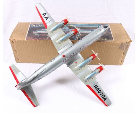 Yonezawa of Japan tinplate battery operated multi-act DC-7C American Airlines plane with box.   CONDITION REPORT:  Don't know
