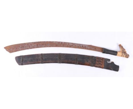 Borneo Dyak mandau or parang ilang headhunters sword with curving plain blade, wire bound carved bone grip and scabbard, blad