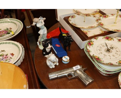 A gun shaped ash tray; a Lladro polar bear; a Nao figure of a golfer etc.