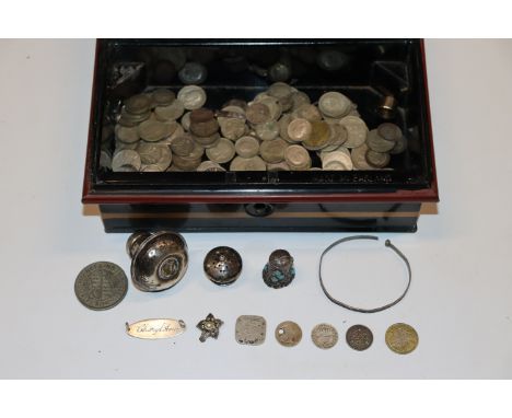 A cash tin and contents of various silver and other coinage, silver tops, thimble, bangle etc. 