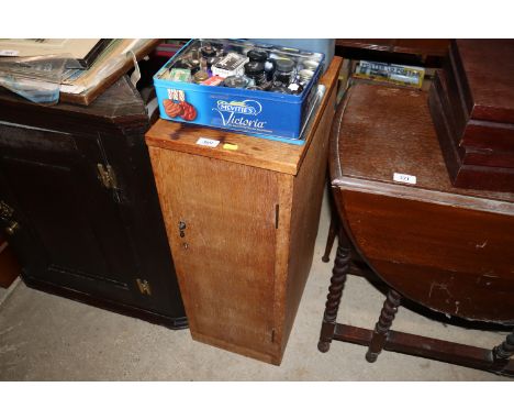 A mid-20th Century golden oak bedside cupboard fitted interior shelf 