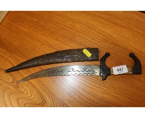 A vintage carved wooden and bone dagger 