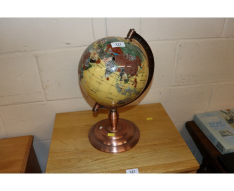 A globe on coppered stand 