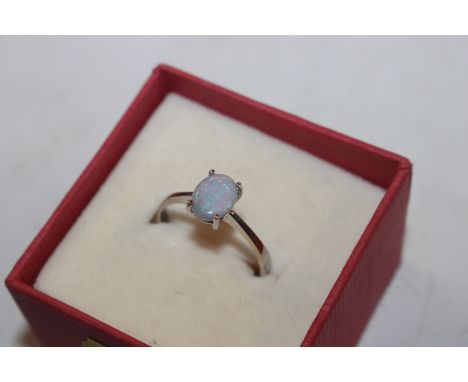 An 18ct white gold and opal doublet set ring, ring size P, approx. total weight 1.8gms 