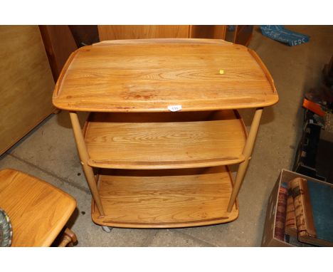 A blond Ercol three tier trolley